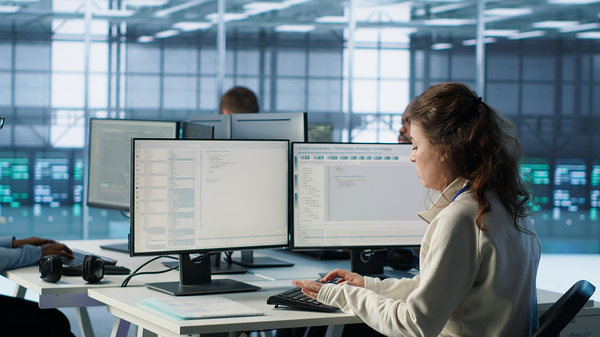 What Is AnyDesk — IT team discussing in data center, symbolizing enterprise deployment
